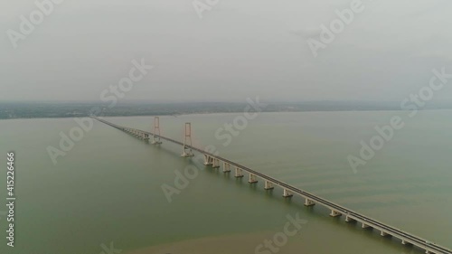 Wallpaper Mural suspension bridge over madura strait with highway and car, surabaya. aerial view bridge Suramadu connecting islands Java and Madura. High coast bridge with highway.java, indonesia Torontodigital.ca