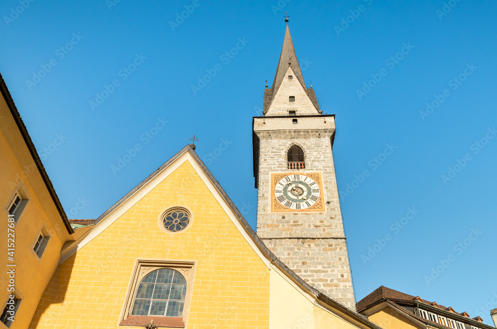 Bell tower of the Ursulinen Holy Saviour church in the historic city of Bruneck or Brunico, South Tyrol, Italy