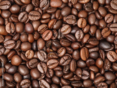 Coffee beans background, big fragrant roasted grains, food photo