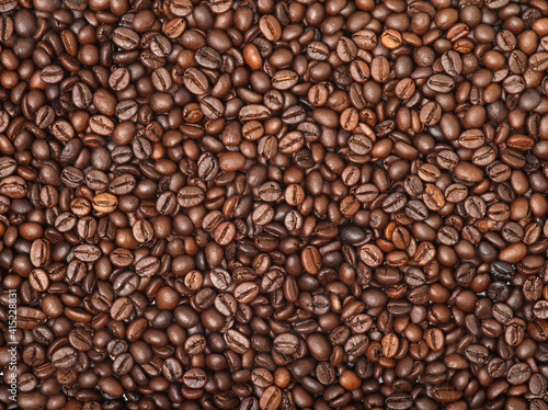 Coffee beans background, big fragrant roasted grains, food photo