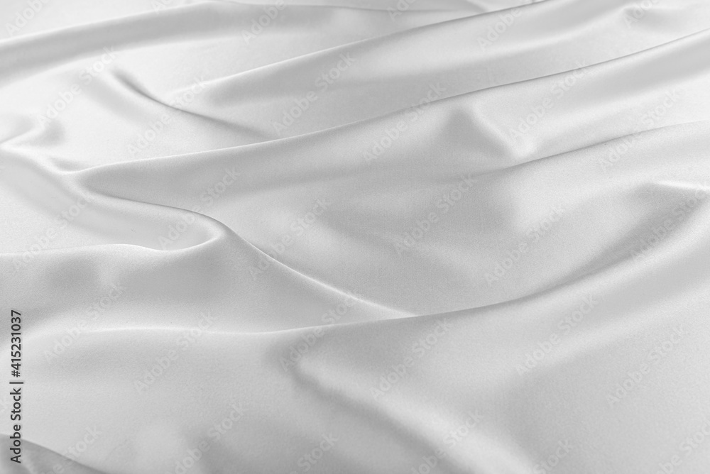 Obraz premium White silk fabric as an abstract background.