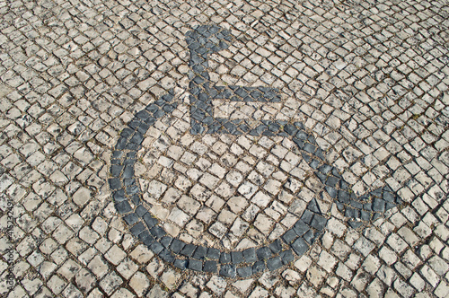 sidwalk,paving,signs,disable,person,wheelchair photo