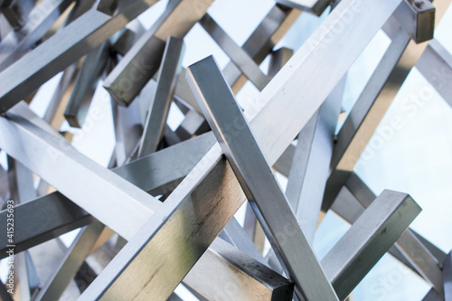 A closeup view of a random lattice design of metal bars.