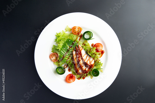 salad with eel and tomatoes. In a plate