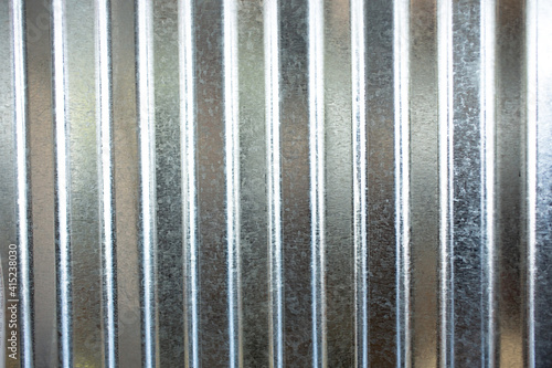 A view of a pleated sheet metal as a wall facade background. photo