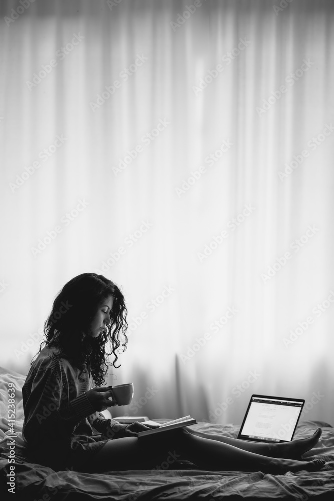 pretty brunette woman in morning bed with books and coffee pretty brunette woman in morning bed with books and coffee