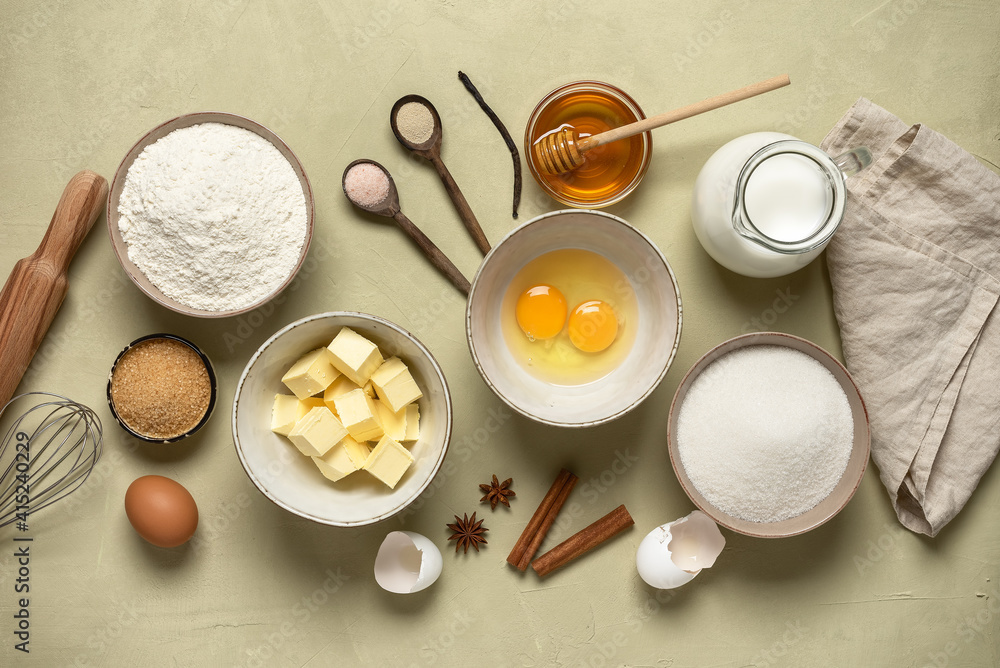 Baking ingredients on a beige concrete background. Top view. Baking ingredients on a beige concrete background. Top view.