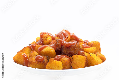 Spicy Roasted Idli - South Indian snacks are made using leftover Idli served with tomato ketchup. selective focus