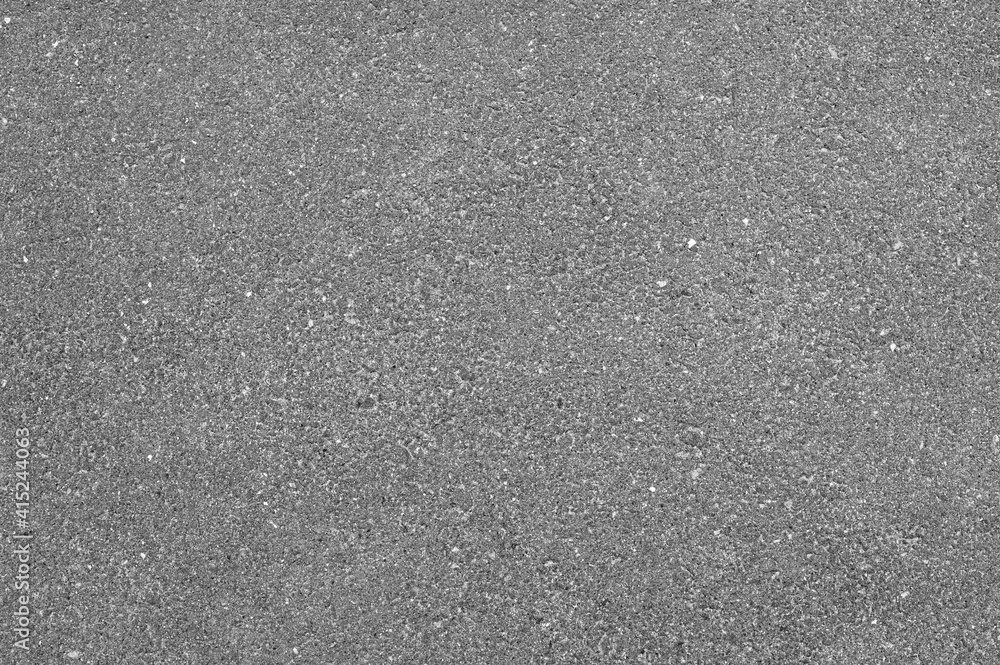 Light grey asphalt road texture, top view.