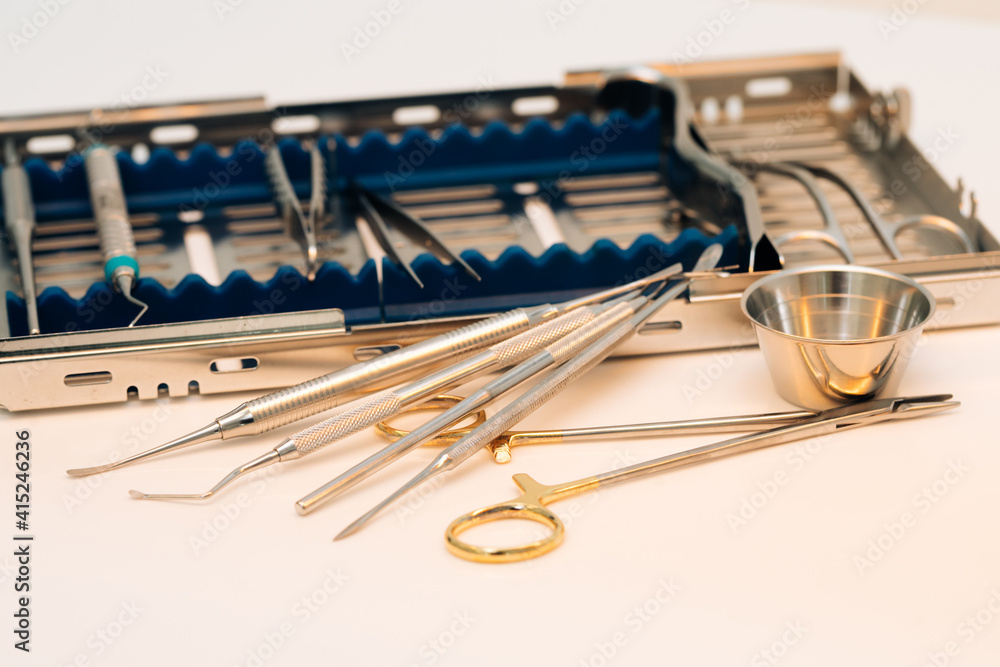 Fototapeta premium Surgical kit of instruments used in dental implantology. Dentist orthopedist tools. Dental implantation surgical set