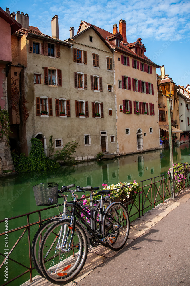 Two bikes on canal embankment in Annecy, France