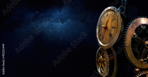 Mechanism of the old clock tower on the night sky background with stars. Philosophy image of space time dimension.