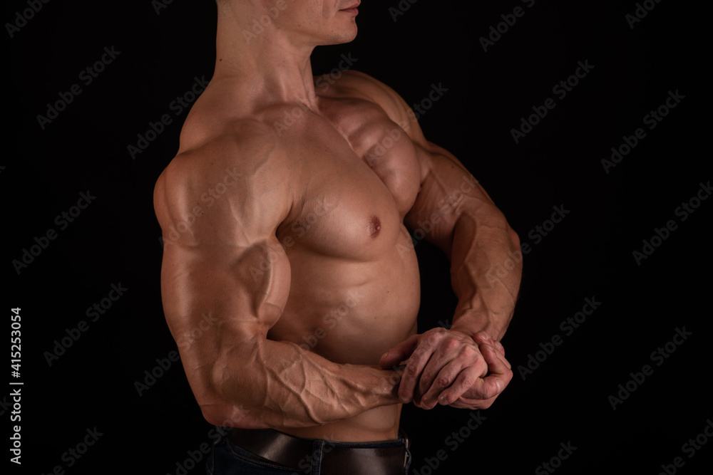 Muscled male model flexing biceps Muscled male model flexing biceps