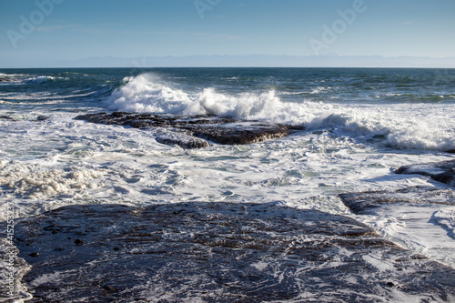 Ocean waves crashing on rocky coast of Juan De Fuca Provincial Park on Vancouver Island, Canada