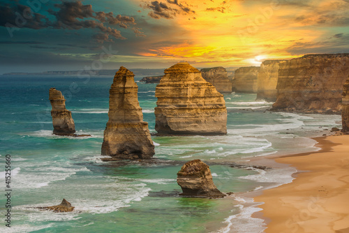 Sunset at the rock formations of The Twelve Apostles in Port Campbell National Park Victoria, Australia photo