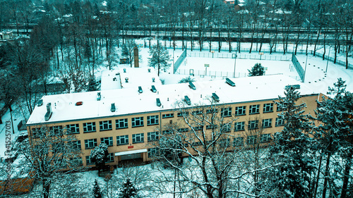 Tracks and playground against the background of the school