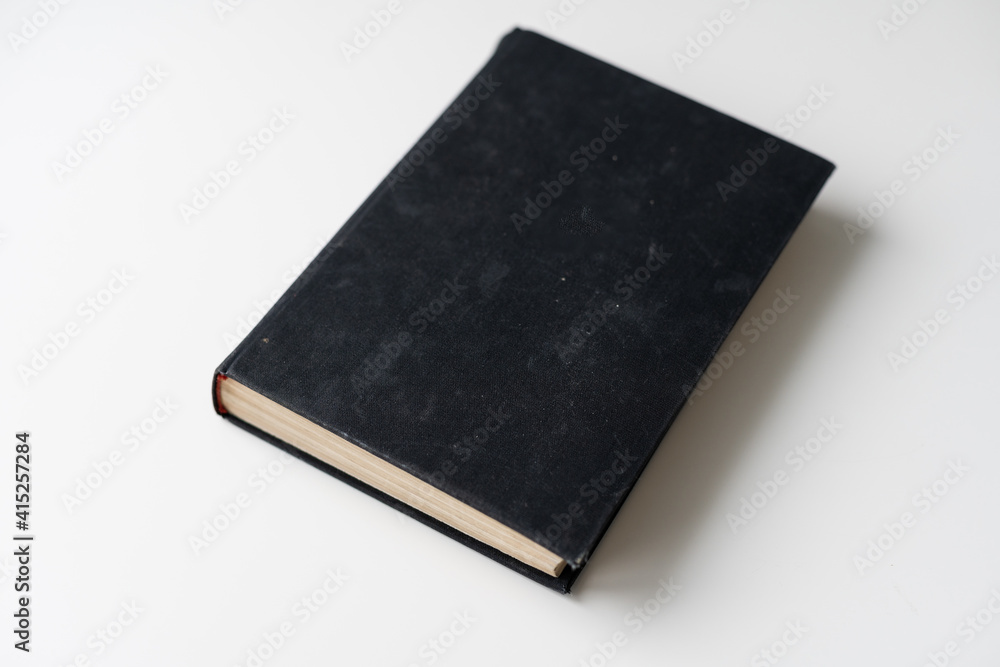 Blank book with black cover on white background. Blank book with black cover on white background.