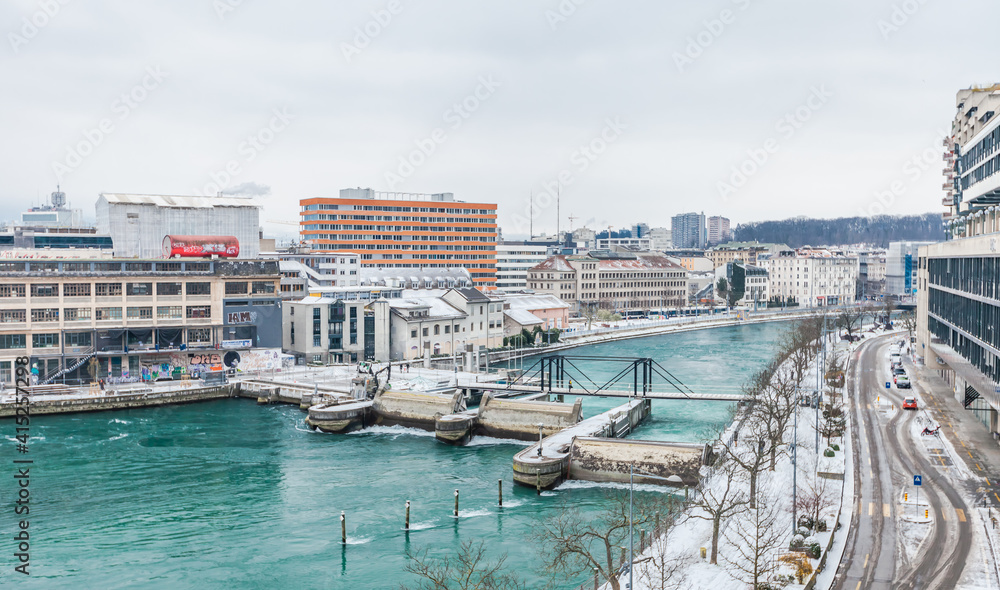 GENEVA, SWITZERLAND - February 13, 2021: Opened waterlocks on the Rhone after snow blizzard, Geneva, Switzerland.