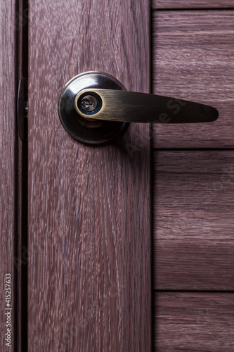 Wallpaper Mural Metal door handle with lock close-up. Front view. Torontodigital.ca