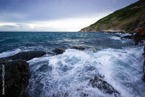waves crashing on rocks © chanin