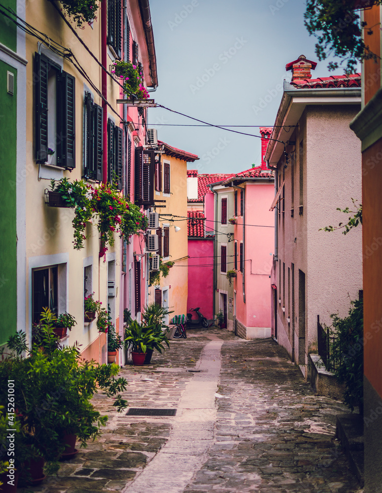 colorful tiny houses in alley bright colourful street slovenia mediteranean