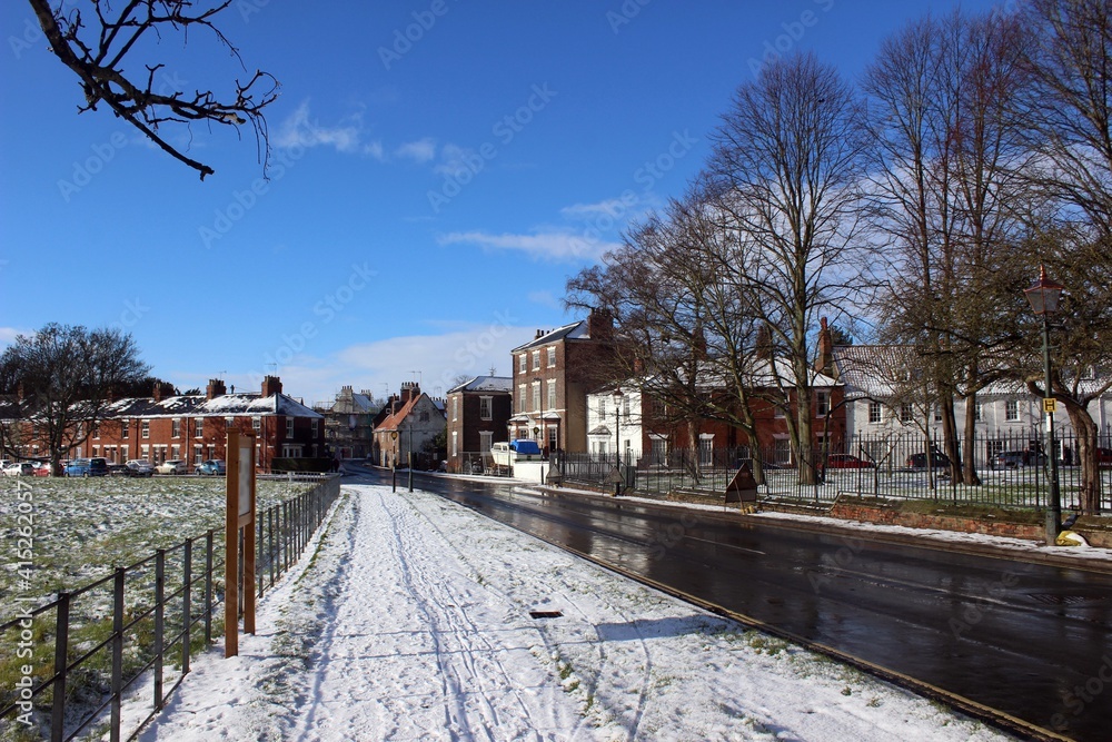 Fototapeta premium Minster Yard South, Beverley, looking towards Keldgate, following a snowfall.