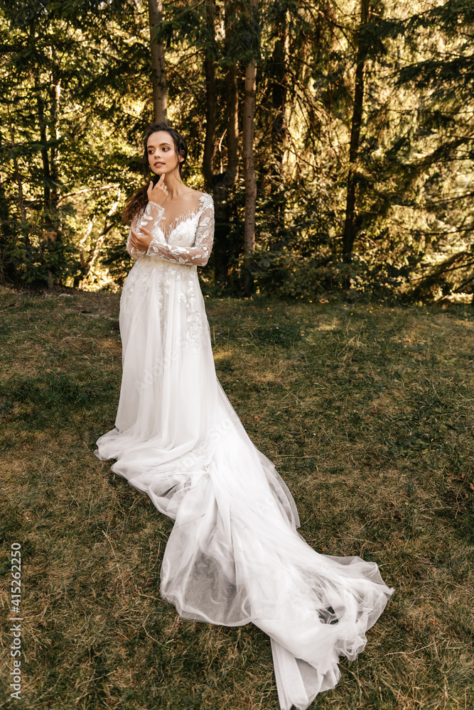 Bride in white dress in nature