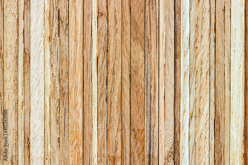 Close-up of a stack of oak strips. The vertically layered textured surface can serve as a background image.