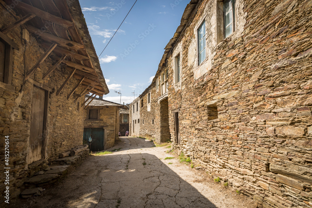 a street with traditional old houses in San Cristobo do Real (San Cristobal del Real), municipality of Samos, province of Lugo, Galicia, Spain
