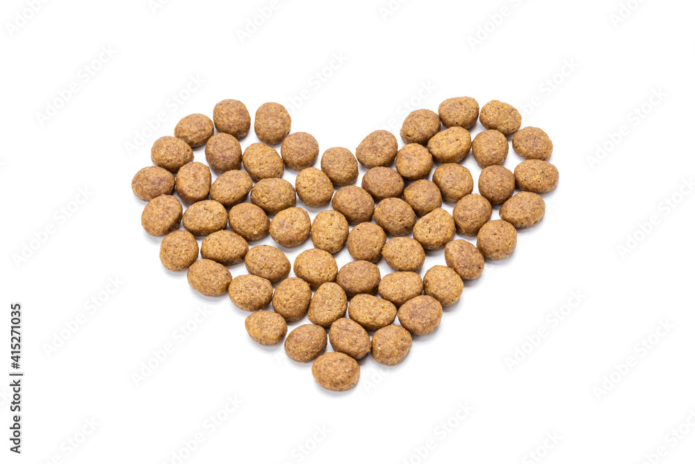 domestic animals dry food isolated on white background. dry cat feed cut out. above view. heart symbol domestic animals dry food isolated on white background. dry cat feed cut out. above view. heart symbol