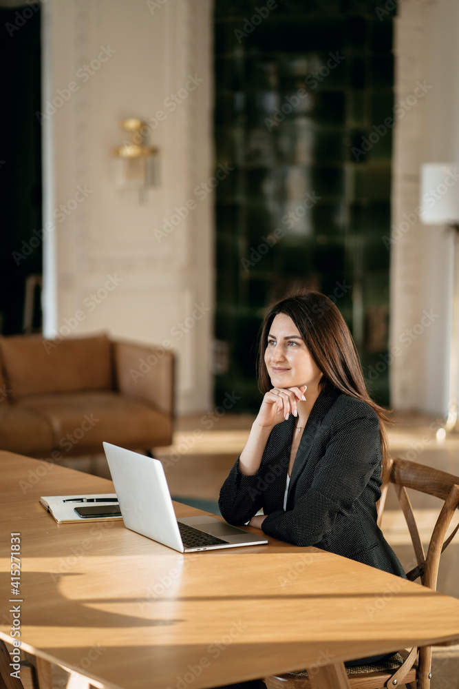 New project at work. The lawyer is sitting next to the laptop. Space for copying. Accountant Manager Student beautiful brunette. A woman writes down important things. Works in a modern office. New project at work. The lawyer is sitting next to the laptop. Space for copying. Accountant Manager Student beautiful brunette. A woman writes down important things. Works in a modern office.