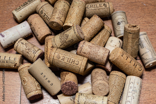 Bunch of wine corks over a white blanket
