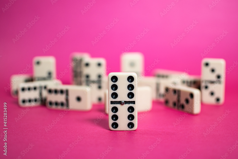 Old fashioned dirty domino on a box with pink solid backround
Old fashioned dirty domino on a box with pink solid backround