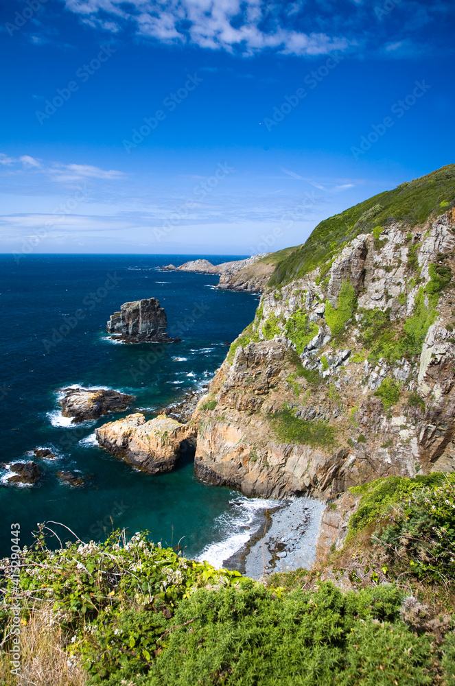 rugged coast of Sark, Channel Islands with beach visible