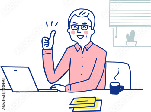 サムズアップをしているリモートワーク中の中高年男性