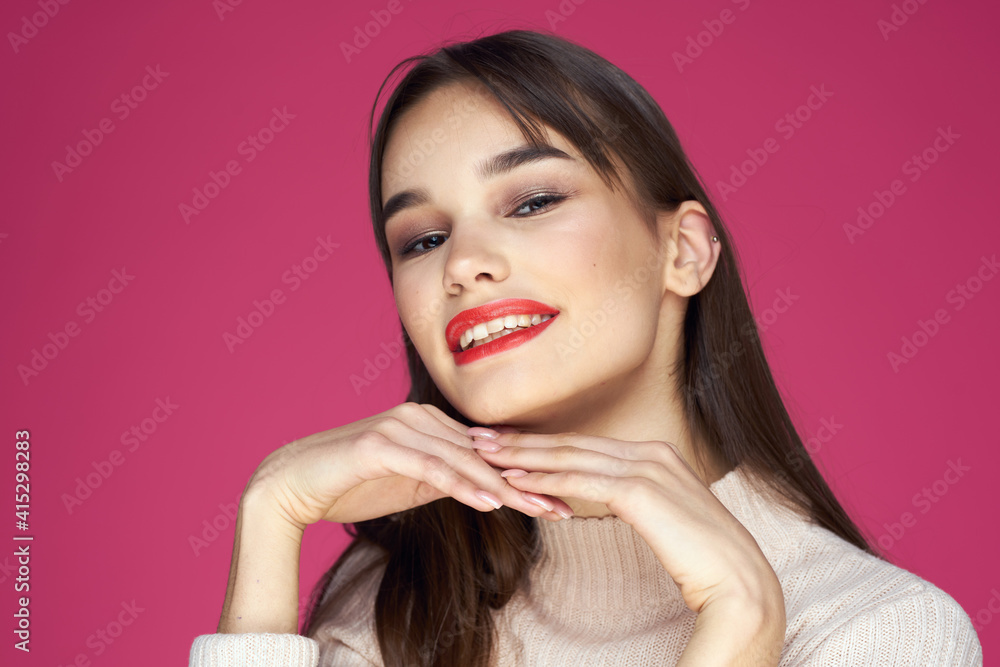 Woman with long hair and red lips white blouse pink background attractive look