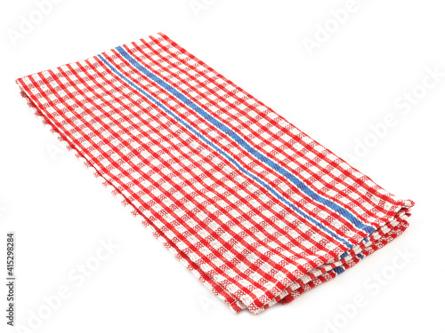 Closeup of red and white checkered fabric or napkin isolated on white background. Concept kitchen utensils and tableware..
