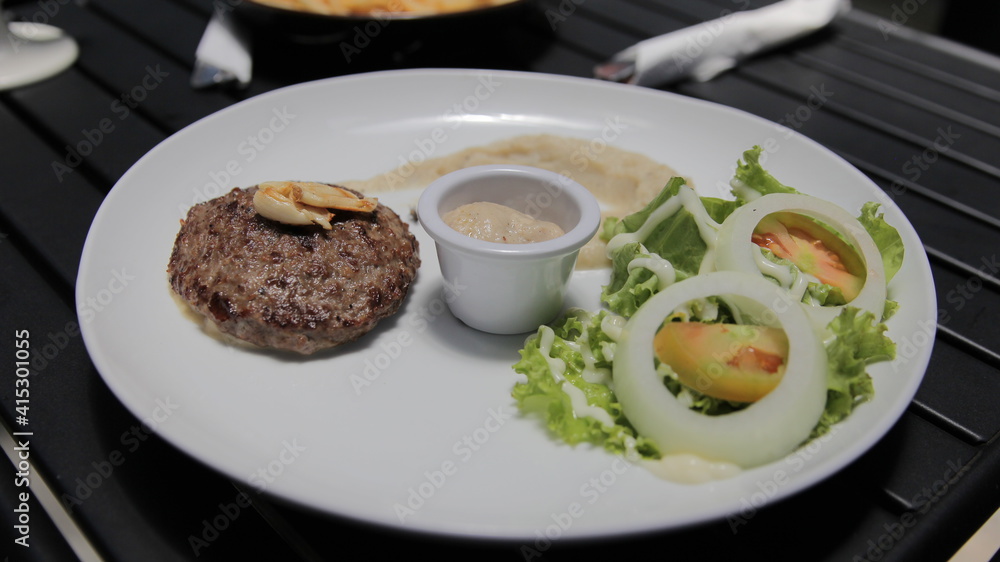 Beef Patty Steak With Mash Potato, Salad, and Mushroom Sauce Beef Patty Steak With Mash Potato, Salad, and Mushroom Sauce