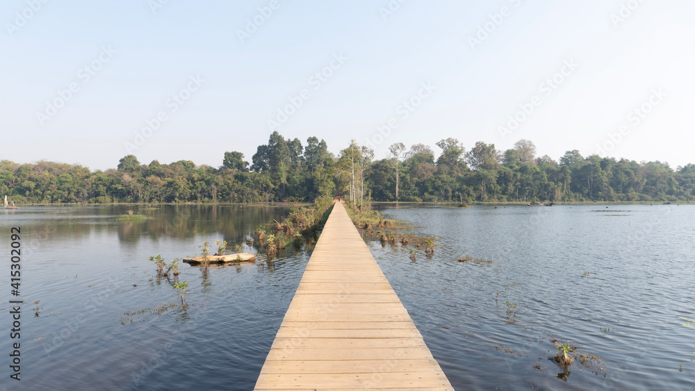 Naklejka premium wooden bridge over lake