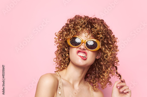 Attractive woman Grimace dark glasses curly hair charm 