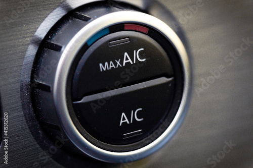 interior view of a modern new car. Climatronic or air conditioner system button. photo