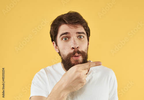 A man in a T-shirt on a yellow background portrait of Copy Space Model