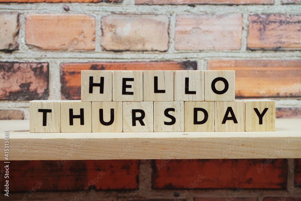 Obraz premium Hello Thursday alphabet letter on shelves wooden background