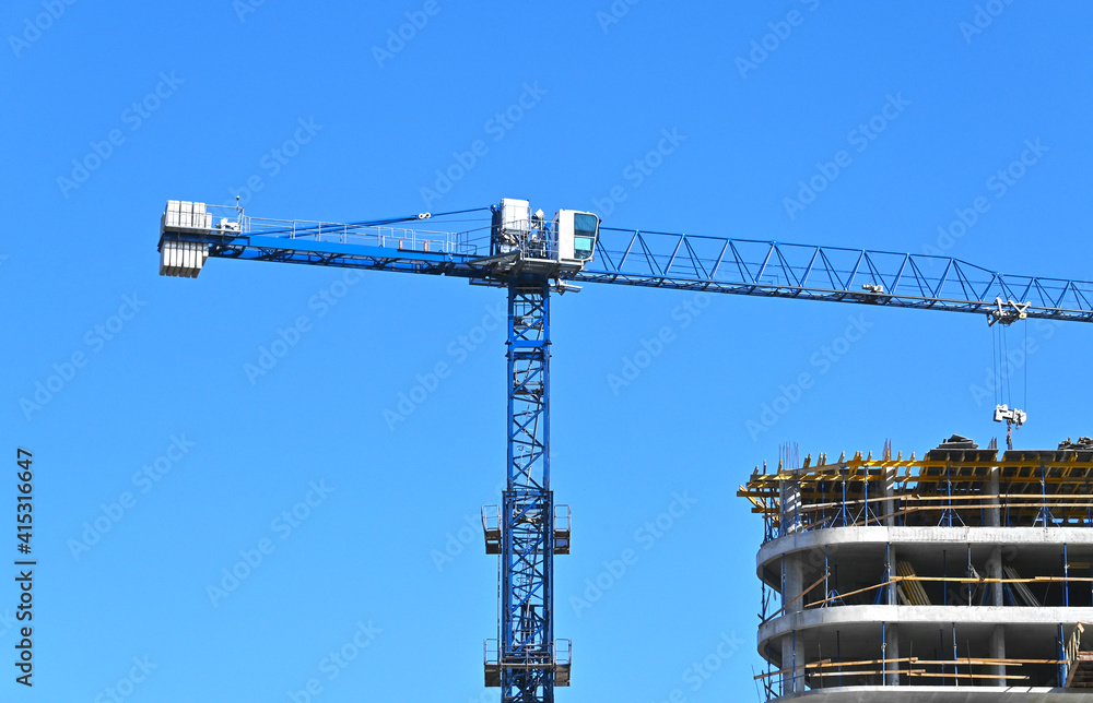 Crane and highrise construction site Crane and highrise construction site