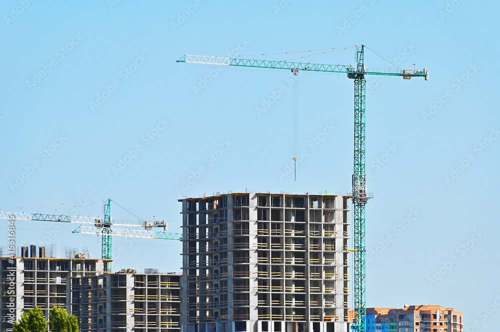 Crane and highrise construction site Crane and highrise construction site