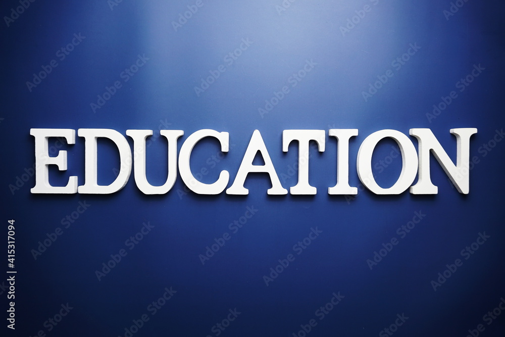 Education alphabet letter on blue background Education alphabet letter on blue background