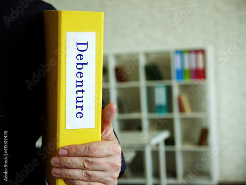 Business concept meaning Debenture with inscription on the piece of paper.