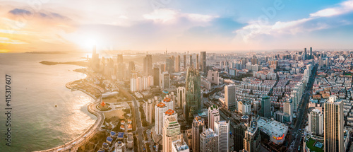 Aerial photography of Qingdao coastline buildings and clouds at dusk