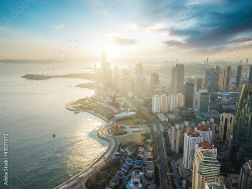 Aerial photography of Qingdao coastline buildings and clouds at dusk