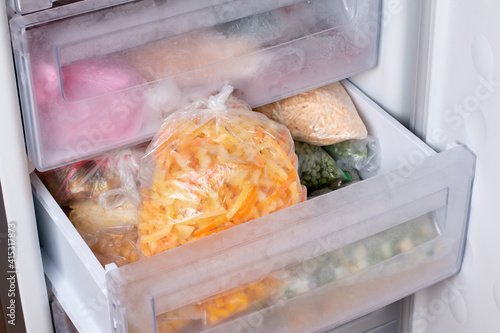 Frozen vegetables in a bag in the freezer. Frozen bell peppers